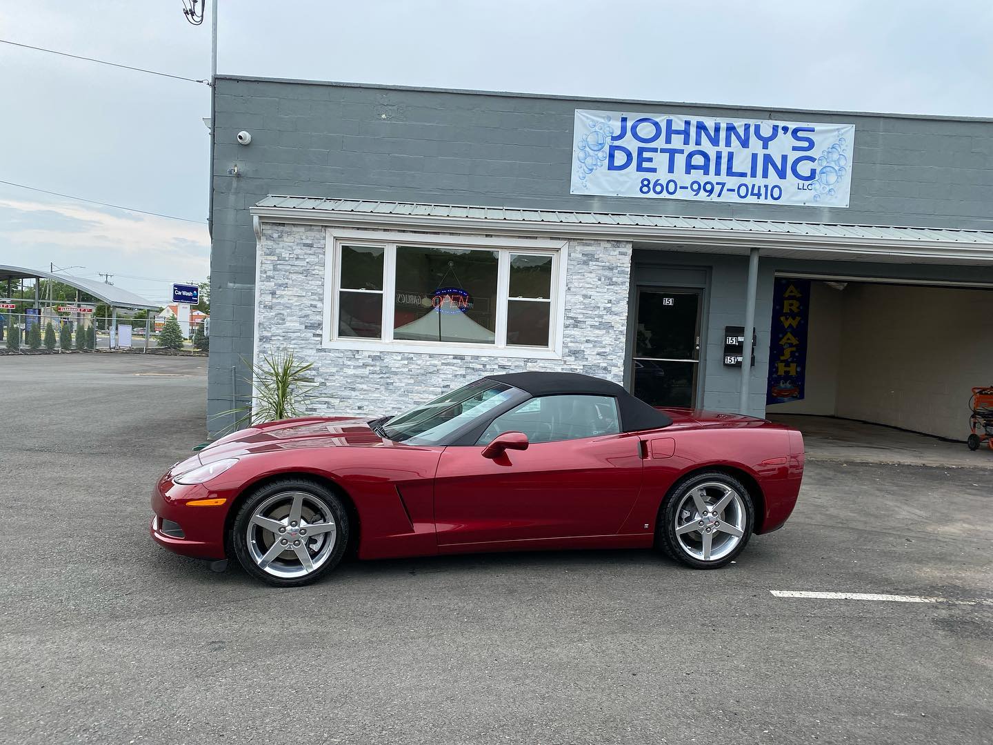 Crimson Chevrolet Corvette convertible detailed